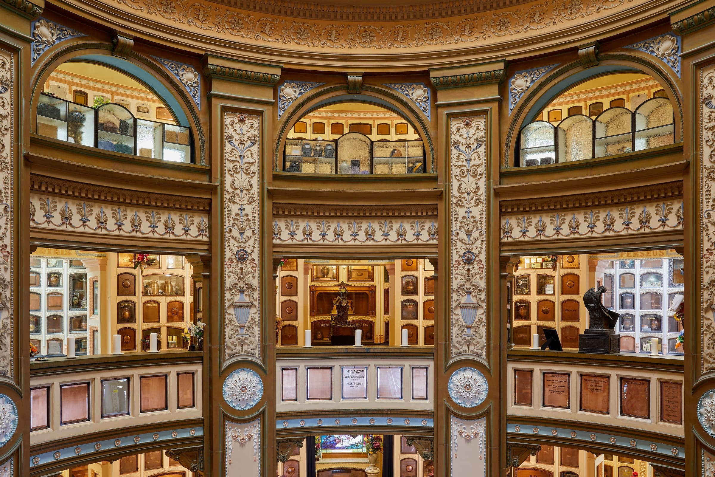 Rows of urn niches inside the San Francisco Columbarium, lit by daylight from a domed ceiling